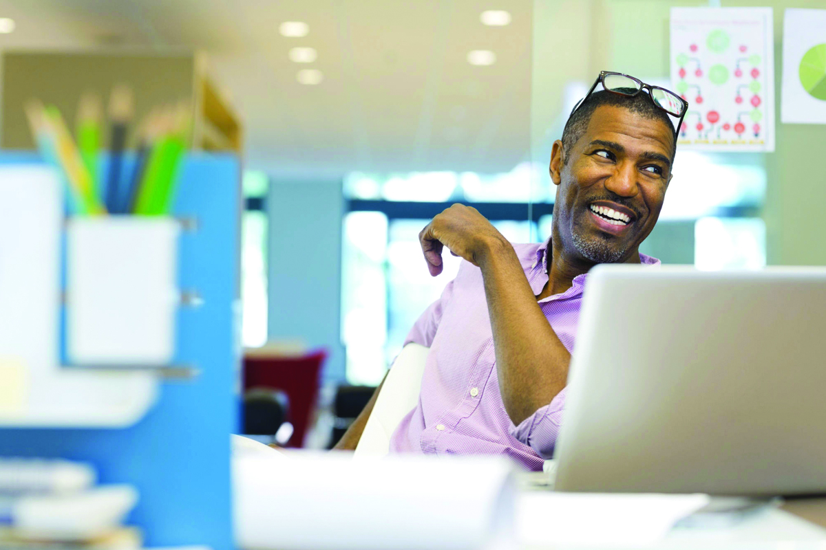 man-smiling-in-office-1200x800.jpg