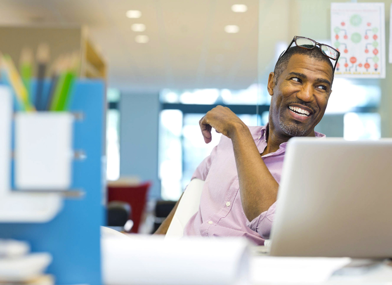 man-smiling-in-office-800x583.jpg