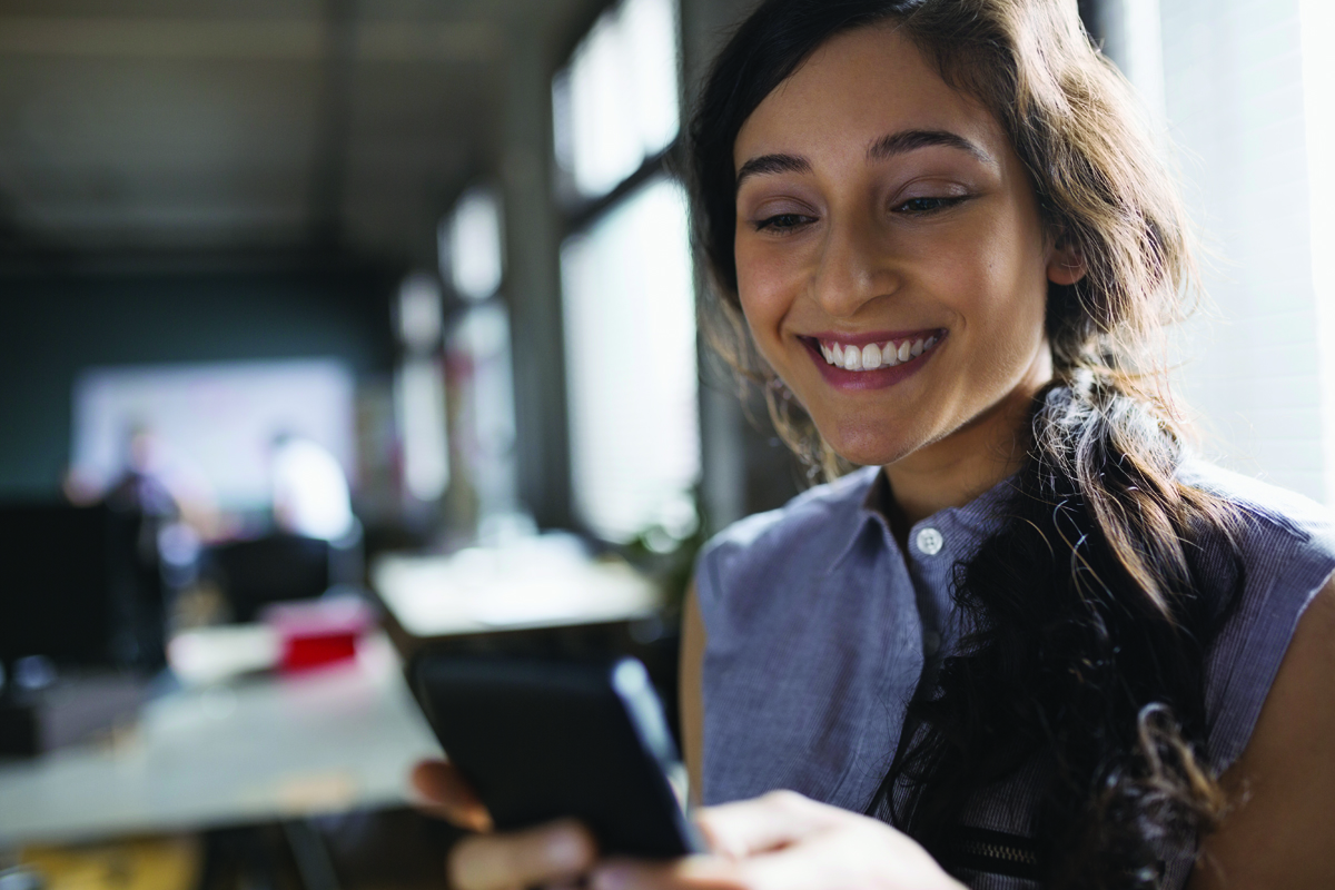 woman-smiling-at-phone-1200x800.jpg