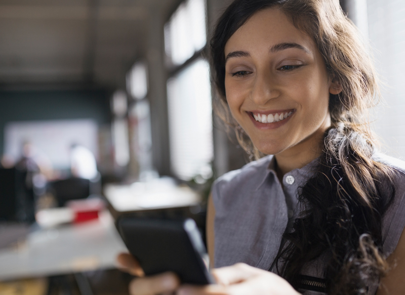 woman-smiling-at-phone-800x583.jpg